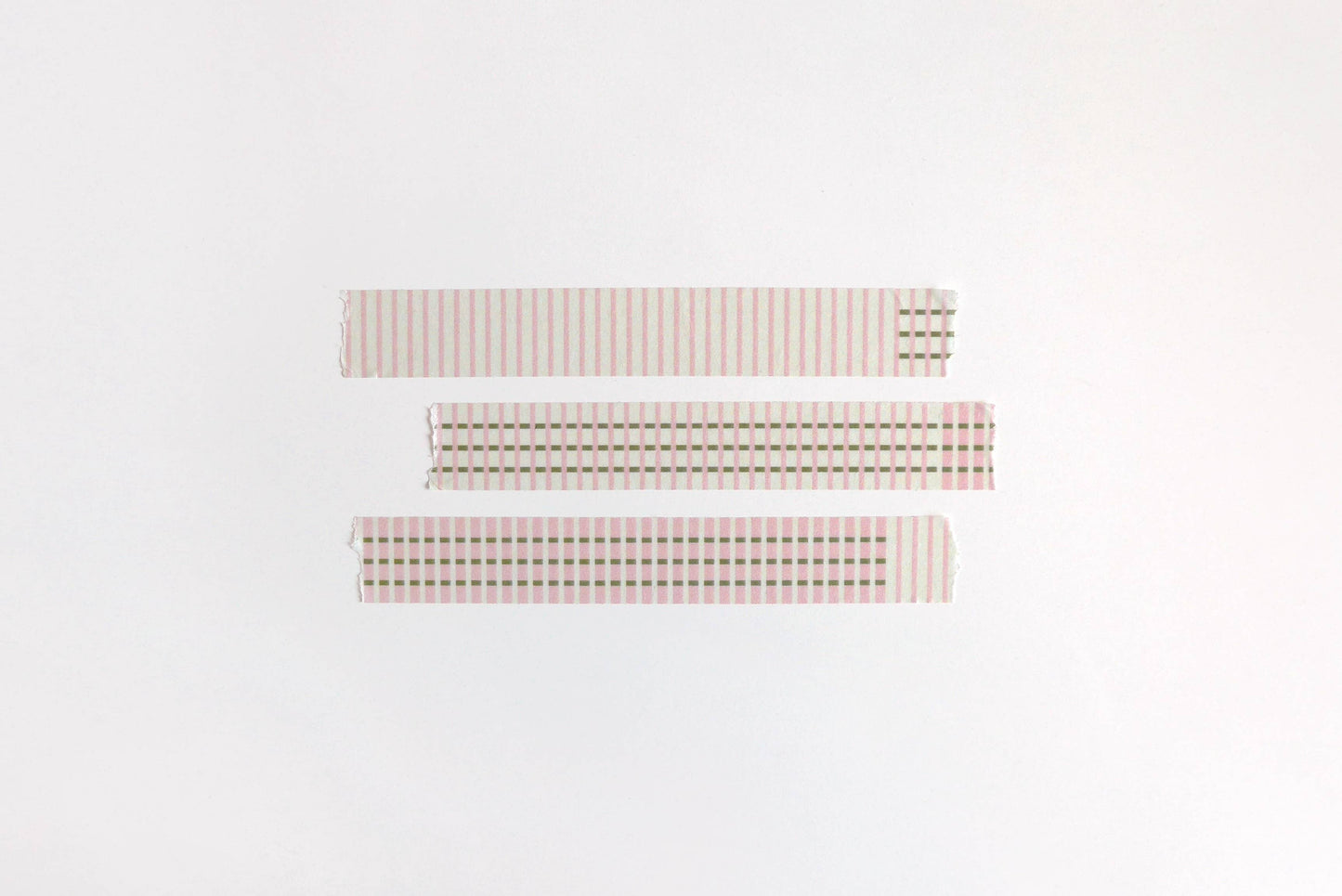 Three rectangular fabric swatches with different checkered patterns on a white background