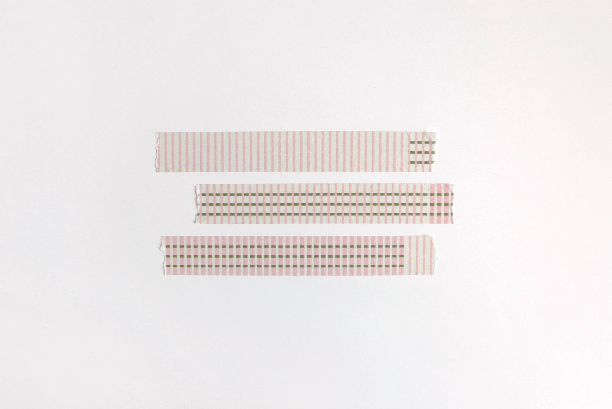 Three rectangular fabric swatches with different checkered patterns on a white background